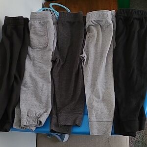 9 pairs of 2t boys pants and 1 onesie
